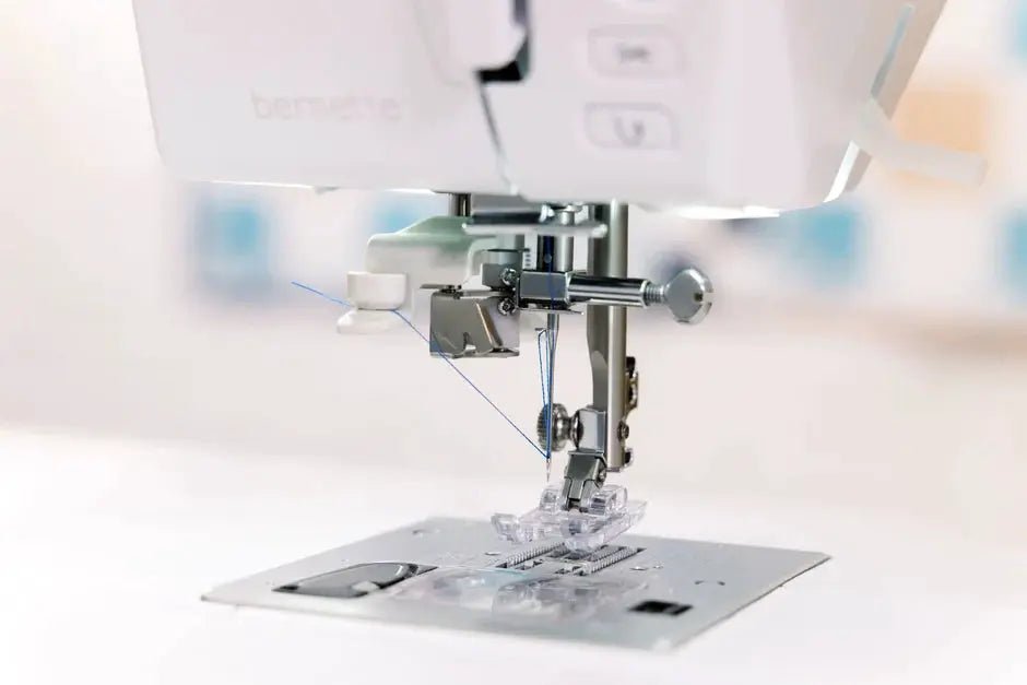 Bernette B57 sewing machine, white finish with metal needle and presser foot close-up