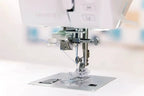 Bernette B57 sewing machine, white finish with metal needle and presser foot close-up