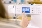 Bernette B57 sewing machine with touchscreen, white finish.