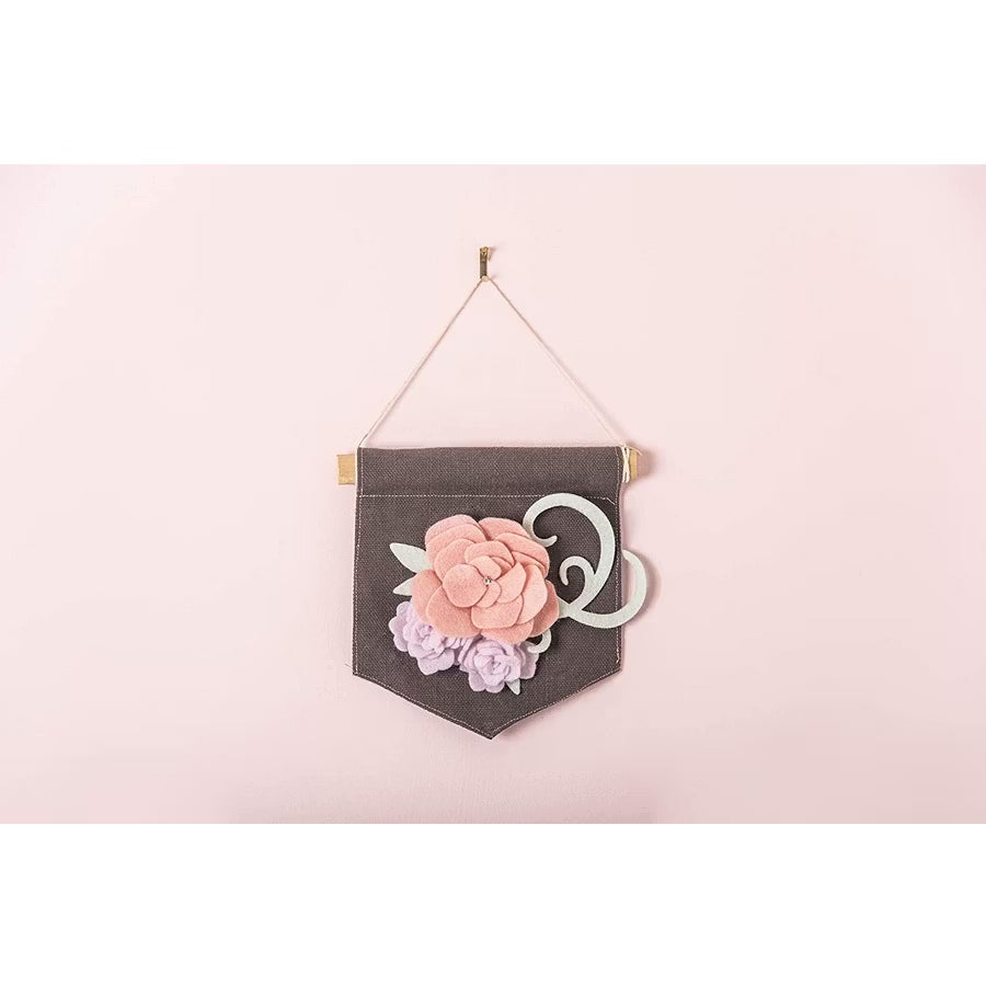 Sizzix Bigz Die Grace by Jennifer Ogborn on dark fabric pennant with pink and lavender floral embellishments