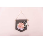 Sizzix Bigz Die Grace by Jennifer Ogborn on dark fabric pennant with pink and lavender floral embellishments