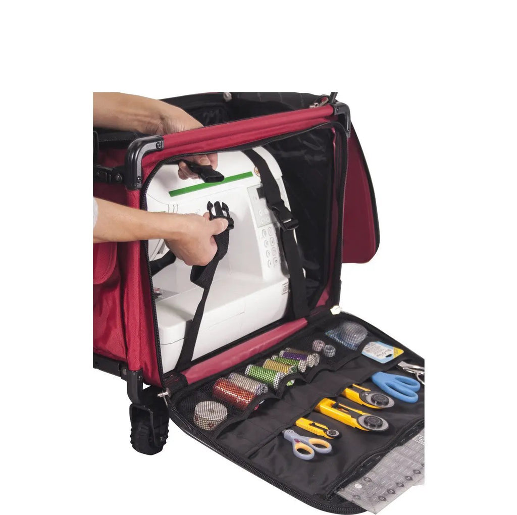 Tutto large machine-on-wheels red bag with sewing machine secured inside and front tool kit with scissors