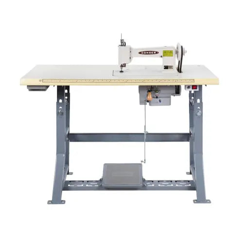 Consew 104-1T industrial sewing machine on beige table with servo motor