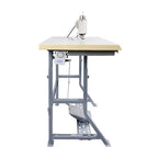 Consew 104-1T industrial sewing machine with beige table and gray metal stand, servo motor