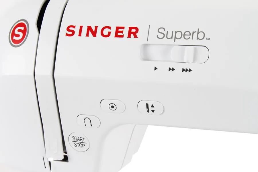 Singer sewing machine, white body with red Singer logo and Superb label