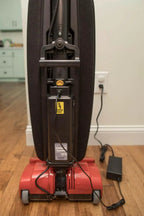 Simplicity S10CV Freedom cordless upright vacuum with red base and black body