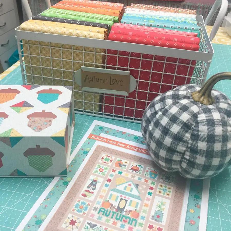 Autumn Love Sew Along Kit by Riley Blake Designs; colorful fabric bundles in a metal basket