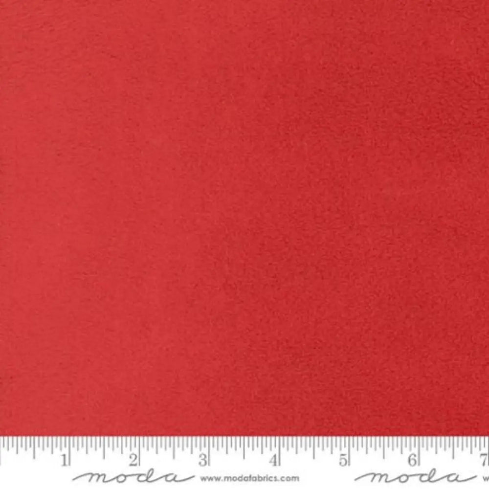 Fireside Christmas Red 60-inch wide polyester fabric with soft plush texture by Moda Fabrics.