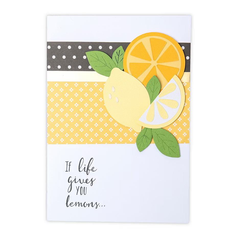 Sizzix Bigz Die Fruit Shapes by Laura Kate cutting dies; lemon and orange fruit shapes with leaves on a yellow card