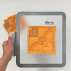 DIME Monster Block Maker hooping aid with orange fabric patch and single-needle setup