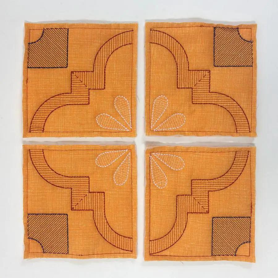 DIME Monster Block Maker quilt blocks: four orange squares with brown geometric stitching.