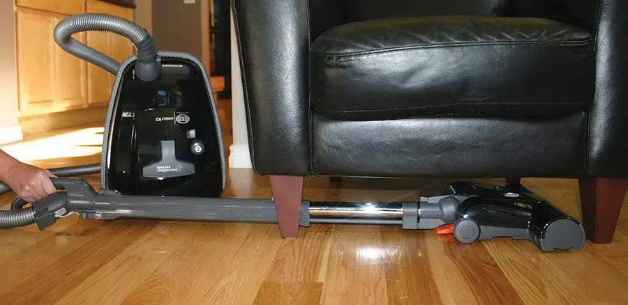 SEBO AIRBELT K3 Premium canister vacuum with ET-1 power head and parquet brush, black on hardwood floor.