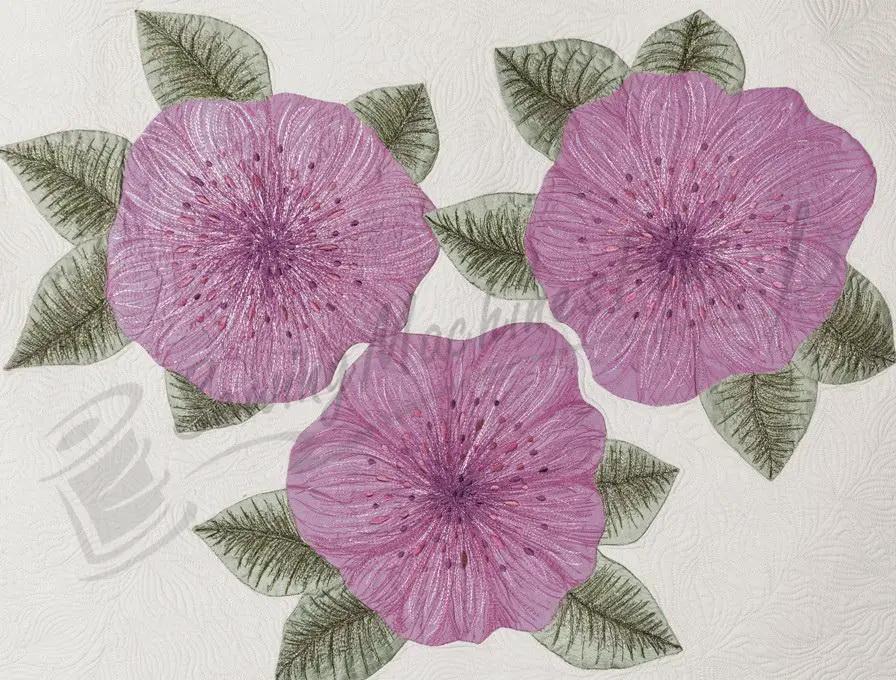 SINGER 8500Q Modern Quilter Sewing Machine with three purple flowers on a textured light quilted background