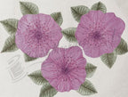 SINGER 8500Q Modern Quilter Sewing Machine with three purple flowers on a textured light quilted background