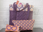 Singer bag set with purple quilted tote and two geometric-pattern zip pouches