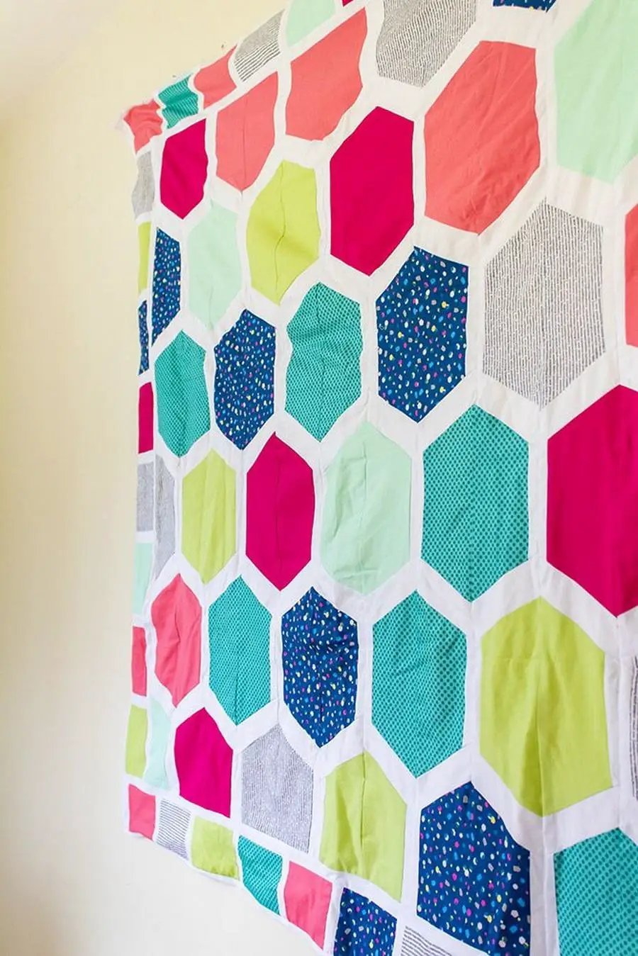 Threaders cutting mats: colorful hexagon quilt fabric in pink, teal, lime with white borders