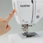 Brother sewing and embroidery machine, white, close-up of head and presser foot