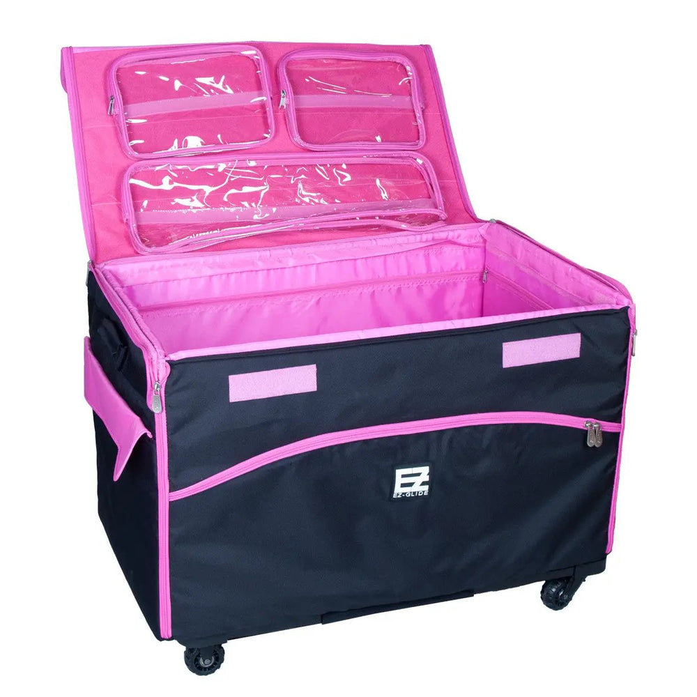 29-inch EZ-Glide trolley machine bag, black with pink interior and clear lid pockets; EZ-Glide logo visible.