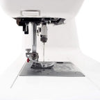 Janome DC2019 computerized sewing machine close-up of needle and presser foot, white finish with free bundle package.
