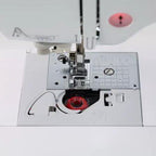 Brother sewing and embroidery machine, white finish with open bobbin area and needle plate.