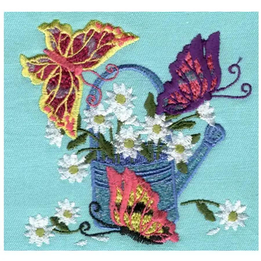 Anita Goodesign Butterflies 19MAGHD embroidery design featuring a blue watering can, white daisies and butterflies