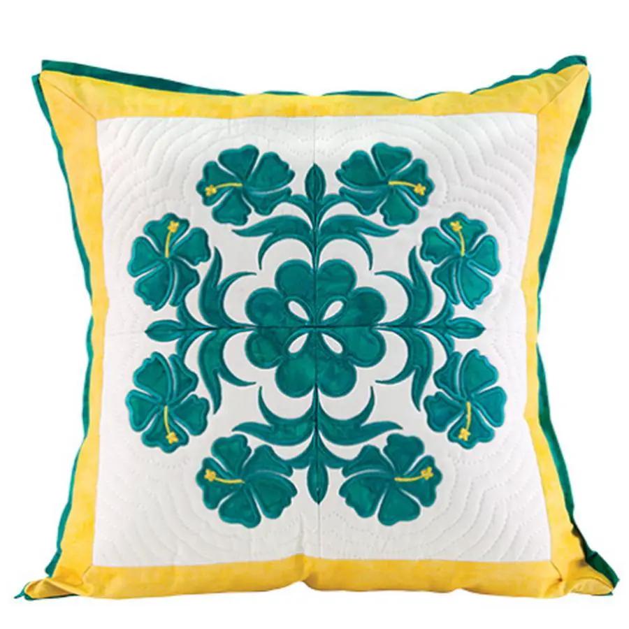 Anita Goodesign Mini Collection Hawaiian Quilt pillow with teal floral embroidery on white, yellow border