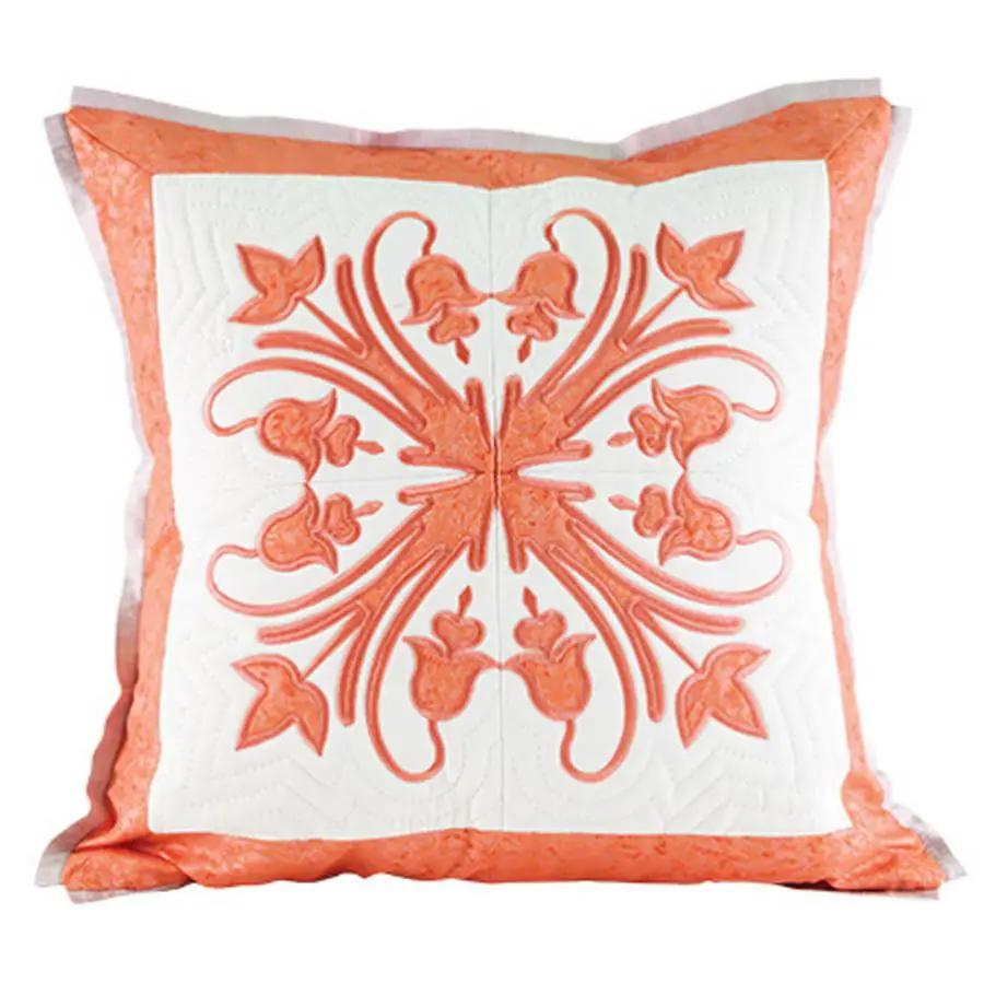 Anita Goodesign Mini Collection Hawaiian Quilt embroidery design pillow, orange floral motif on white with border.