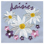 Anita Goodesign Daisies 12MAGHD embroidery design on fabric; 3 large white daisies with yellow centers and blossoms.