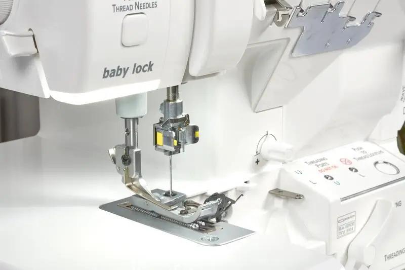 Baby Lock Serenity 4-Thread Serger, white machine with visible threading area