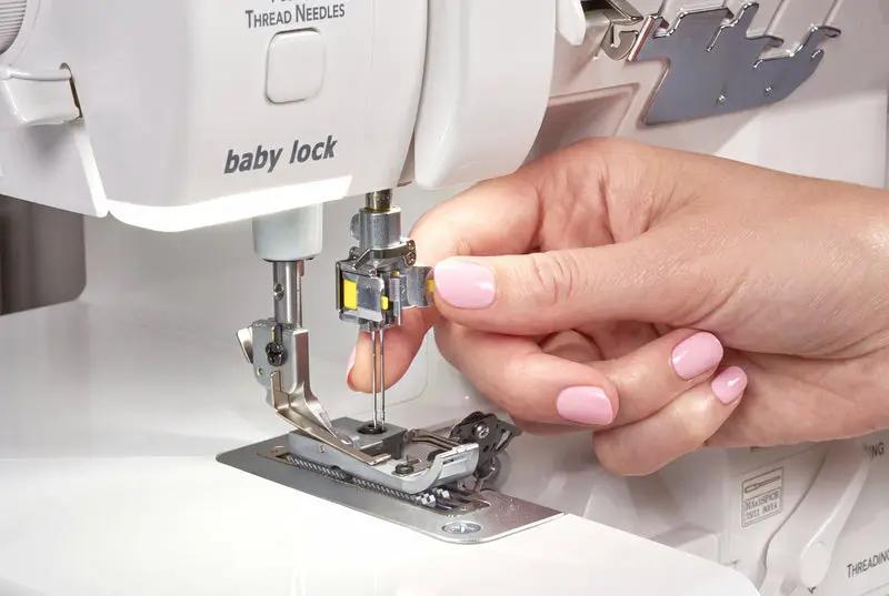 Baby Lock Serenity 4-Thread Serger sewing machine, white with pink nails, shown threading.