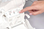 Baby Lock Serenity 4-Thread Serger in white, finger pressing threading control