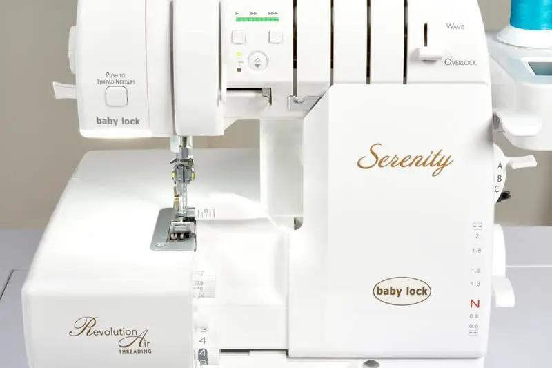 Baby Lock Serenity 4-Thread Serger, white sewing machine with gold script logo and Revolution Air threading