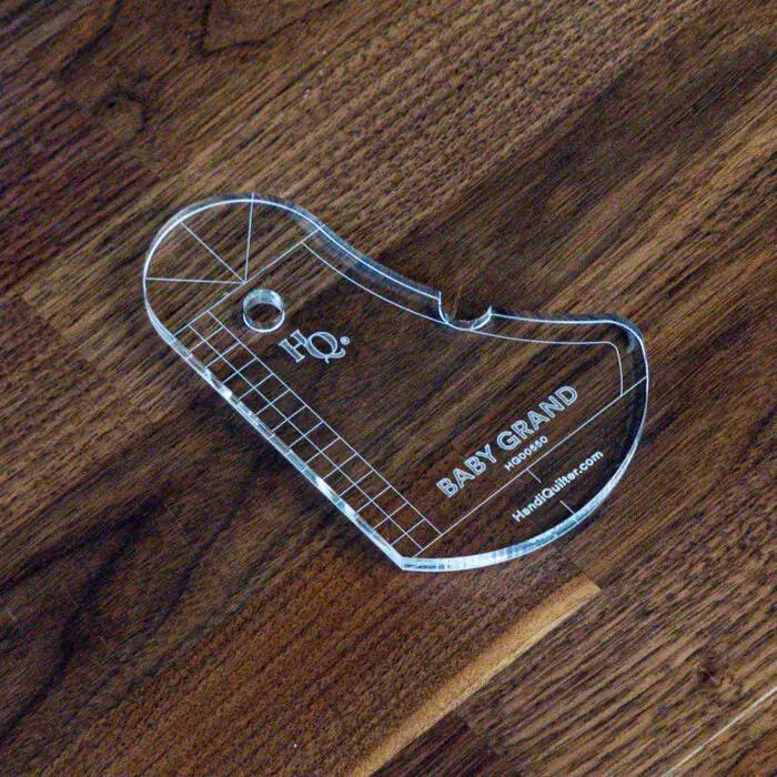 Baby Grand Quilting Ruler by Handi Quilter, clear acrylic piano-shaped quilting tool.