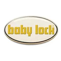 Baby Lock logo; cream oval with gold lowercase text and black outline.