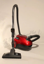 The Bank Robber canister vacuum, red finish with long wand, flexible hose, and floor nozzle