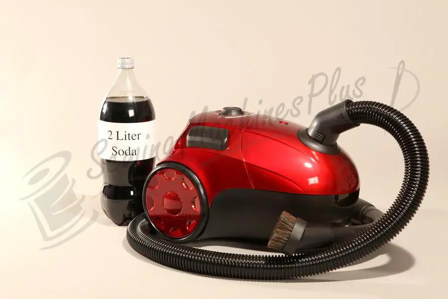 The Bank Robber Canister Vacuum, red with flexible hose and brush attachment