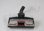 The Bank Robber canister vacuum head; black plastic with chrome plate and red brush strips