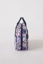 Bluefig Quilter Deluxe Combo bag in pastel floral fabric with navy handles
