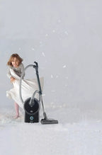 SEBO AIRBELT D4 Premium canister vacuum, black, with hose and floor nozzle.