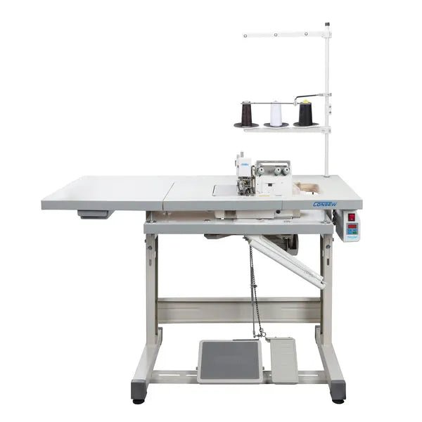 Consew CM793 serger with assembled table and servo motor on white metal frame with thread spools