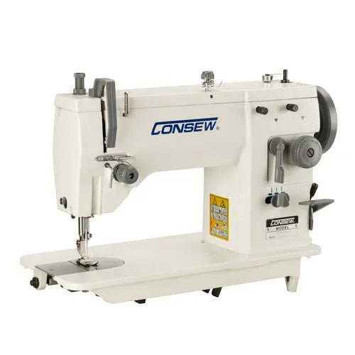 Consew CN2053R-1 sewing machine with assembled table and servo motor; white industrial unit