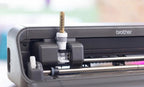 Brother Bellissimo CT1 Cutting Machine; close-up view shows blade carriage and visible Brother logo.