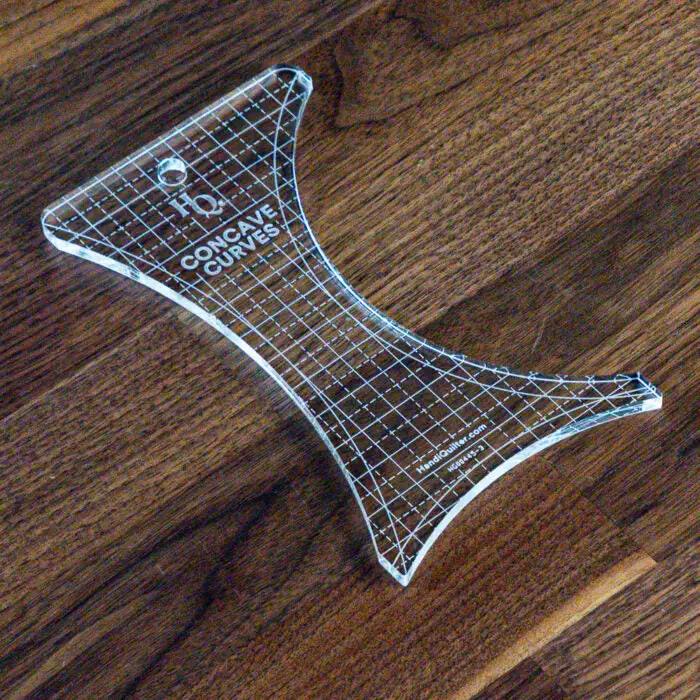 Handi Quilter Concave Curves Ruler, clear acrylic quilting ruler with grid marks.