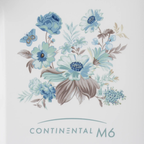 Janome Continental M6 sewing machine cover with blue floral bouquet on white background