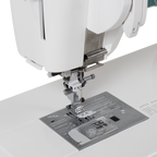 Janome Continental M6 sewing and quilting machine, white body with metal throat plate and presser foot
