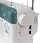 Janome Continental M6 sewing and quilting machine with teal front panel on white body