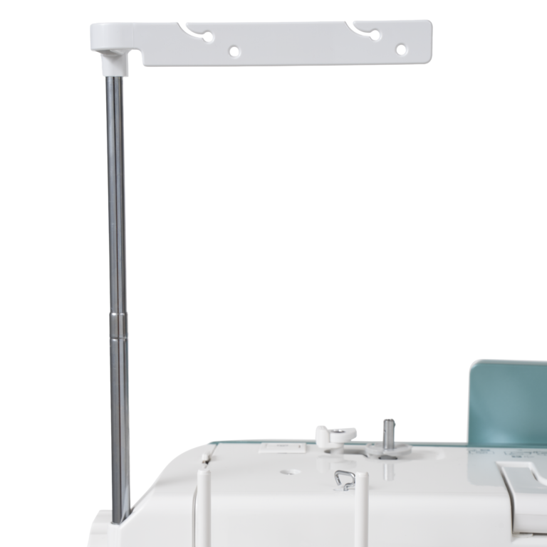 Janome Continental M6 sewing and quilting machine with white body and teal panel.
