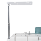 Janome Continental M6 sewing and quilting machine with white body and teal panel.