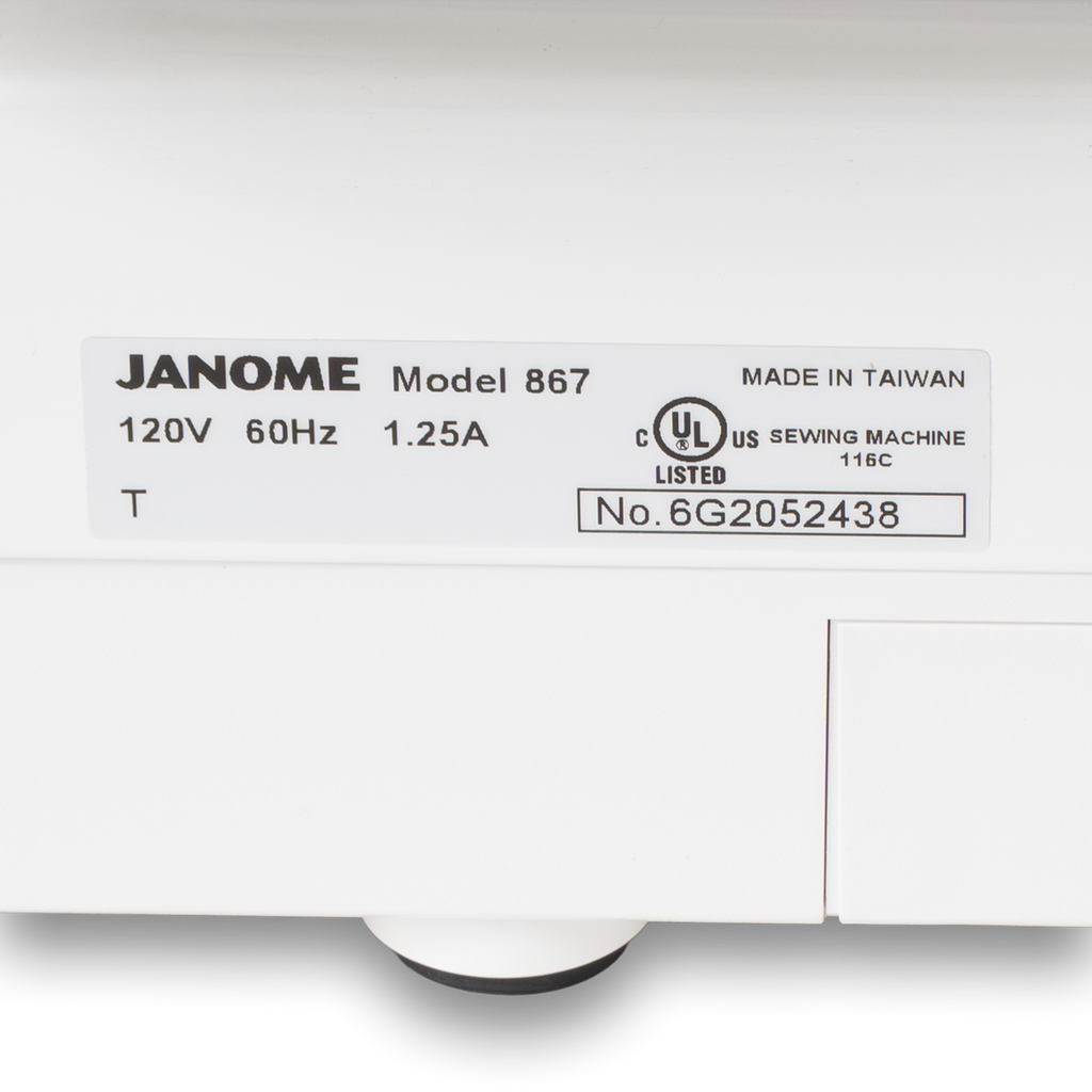 Janome sewing machine label on a white box showing Model 867, made in Taiwan, UL listed.