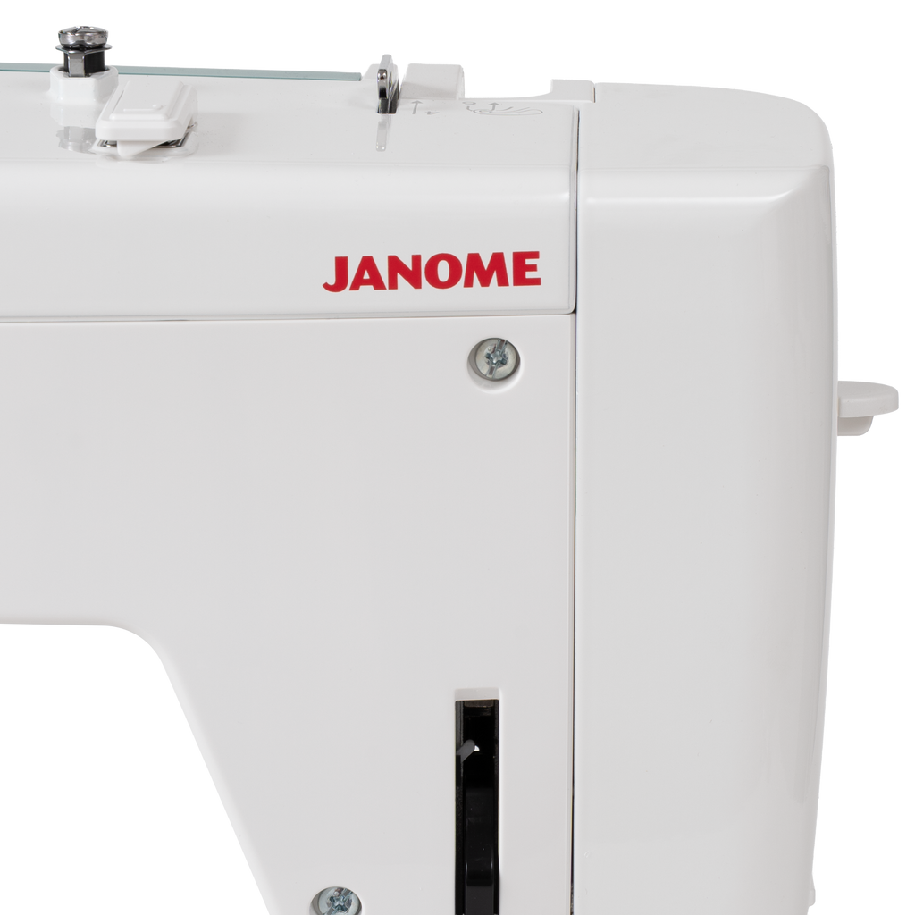 Janome Continental M6 sewing machine; white body with red JANOME logo visible.